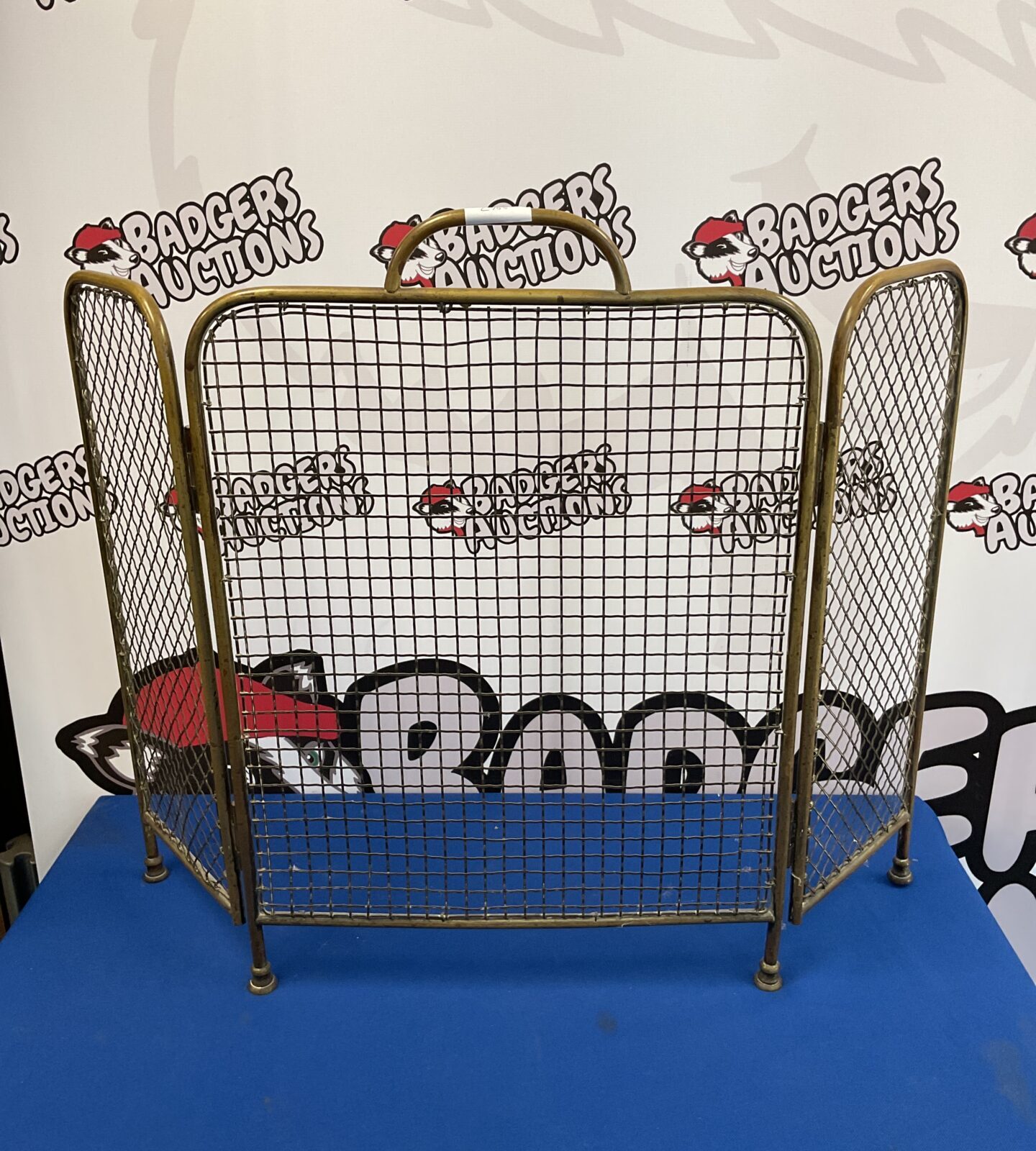 Small tri-fold brass firescreen