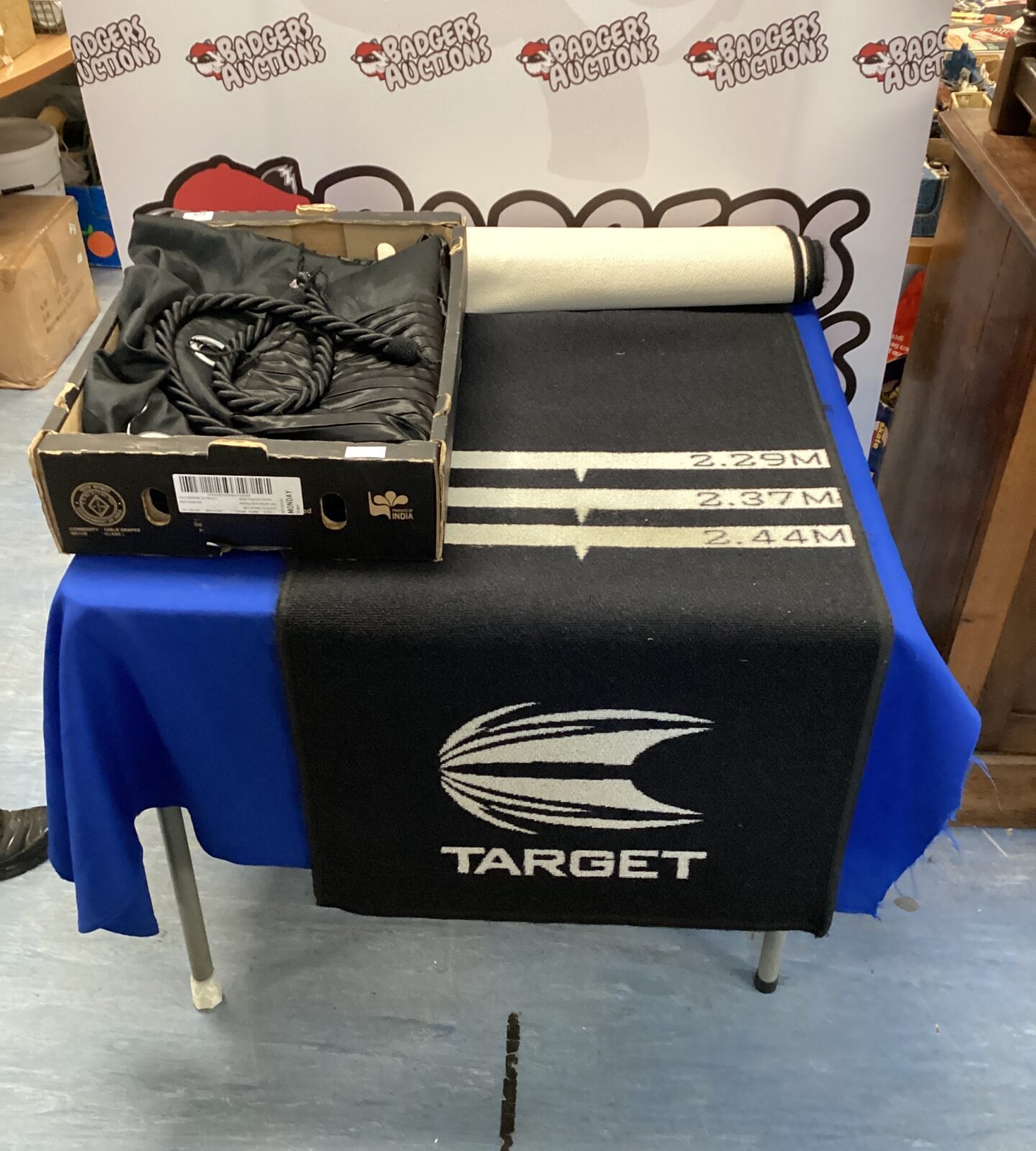 Target Darts mat with two black full length curtains with ties