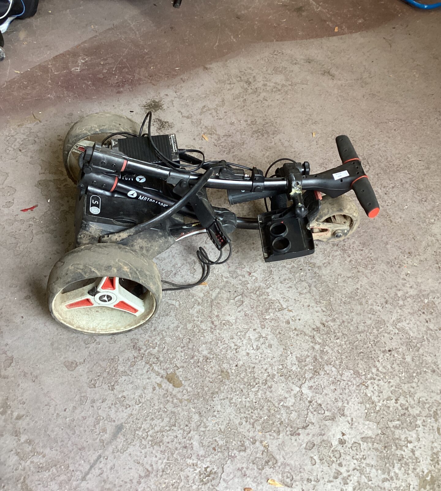 Golf Motocaddy with charger in need of repair