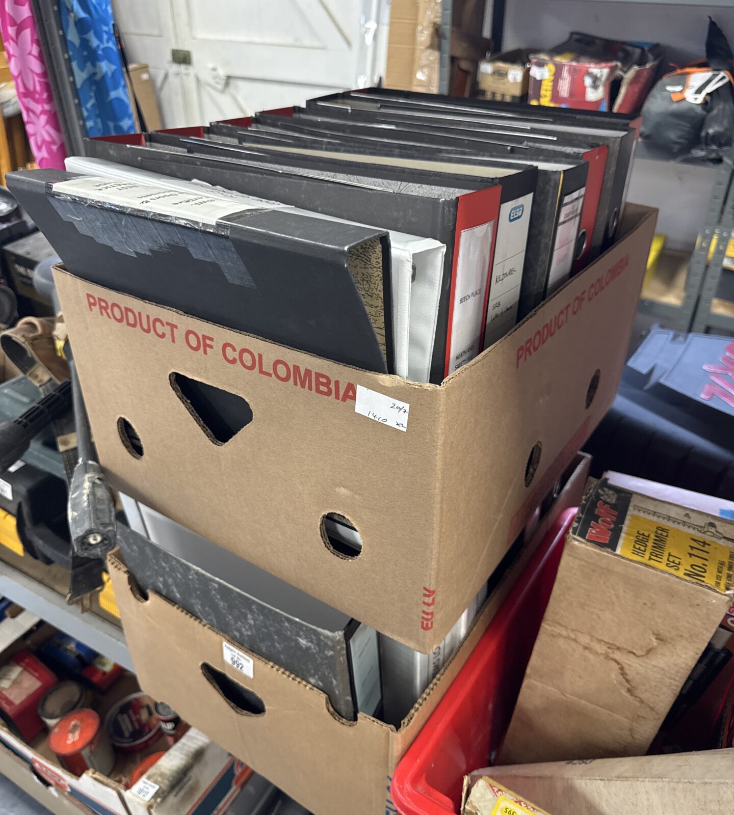 Two boxes of assorted ring binders