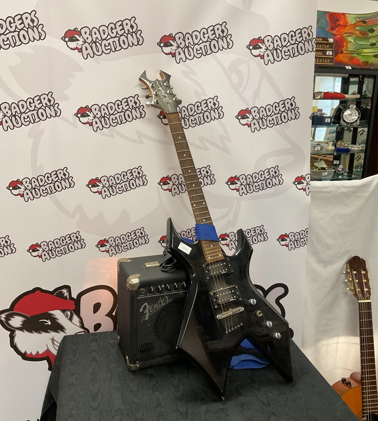 B c rich platinum series warlock electric guitar with fender amplifier