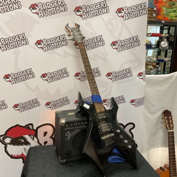 B c rich platinum series warlock electric guitar with fender amplifier