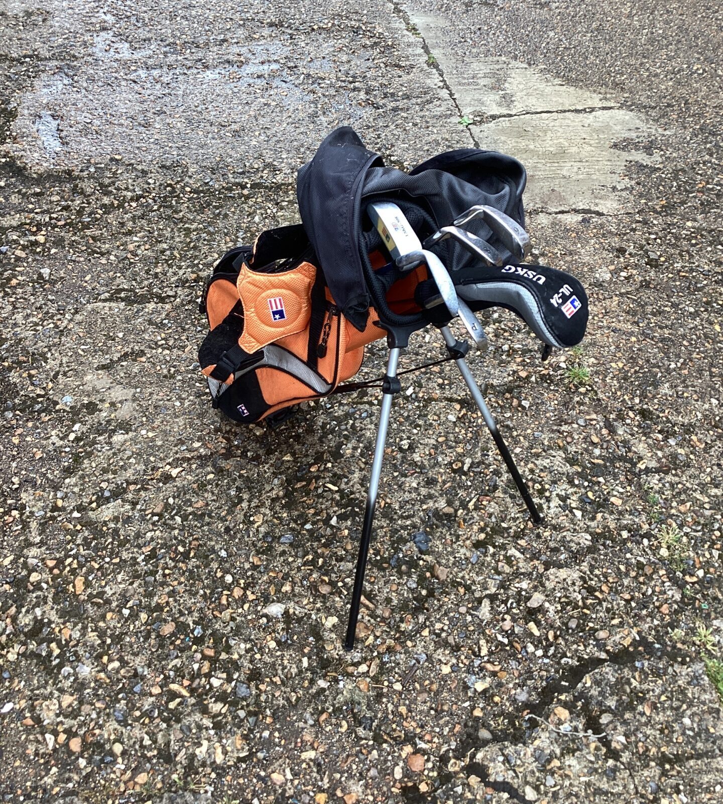 Set of childs golf clubs with bag