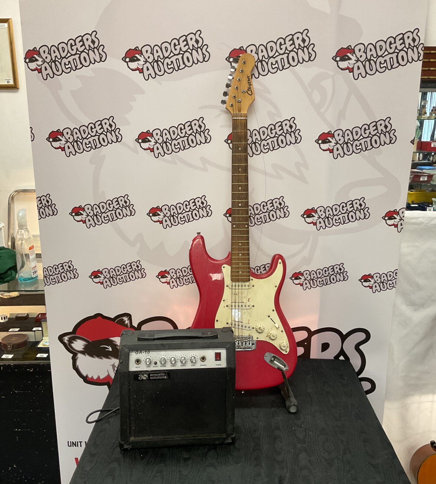 Red cheetah electric guitar with acoustic solutions amplifier