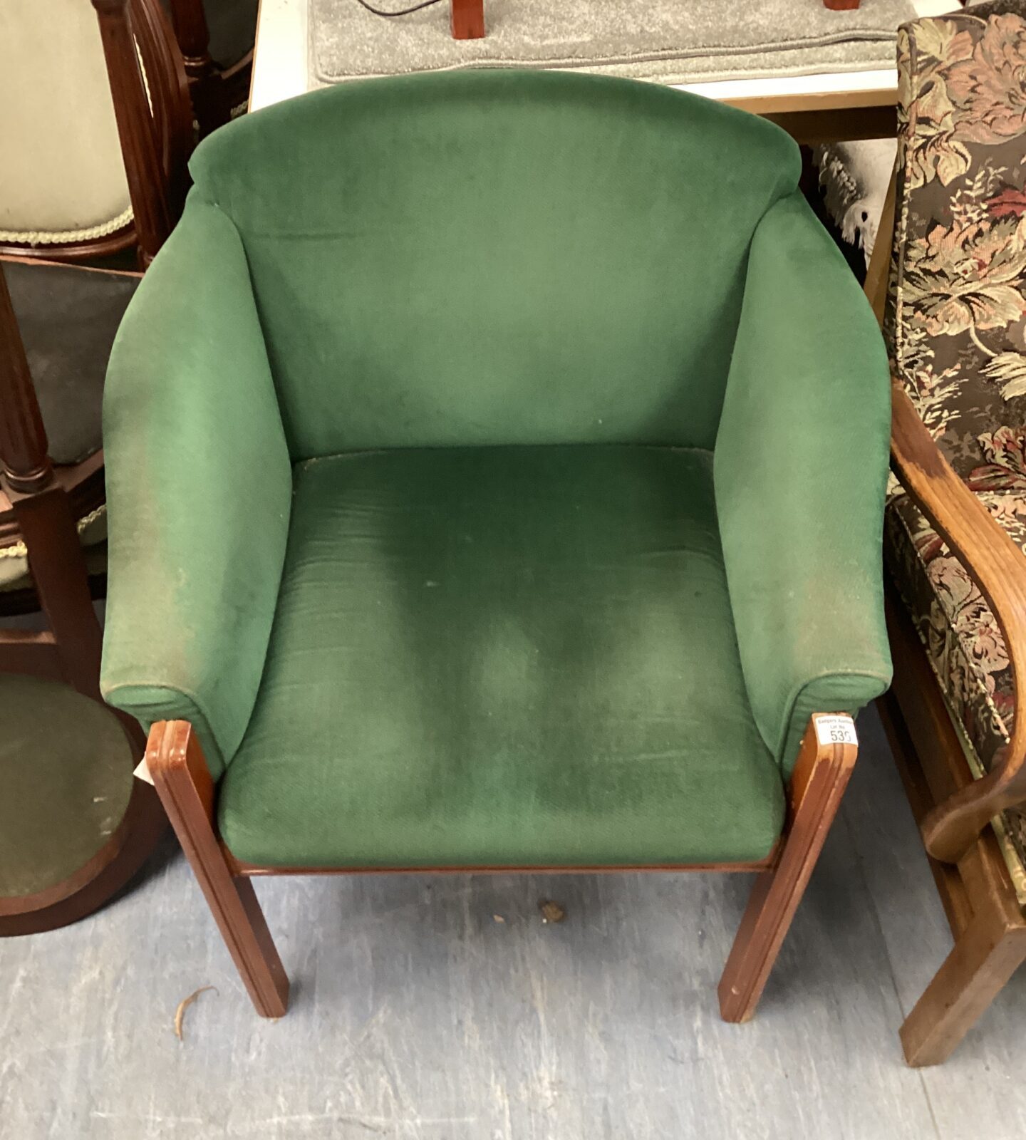 green fabric tub chair
