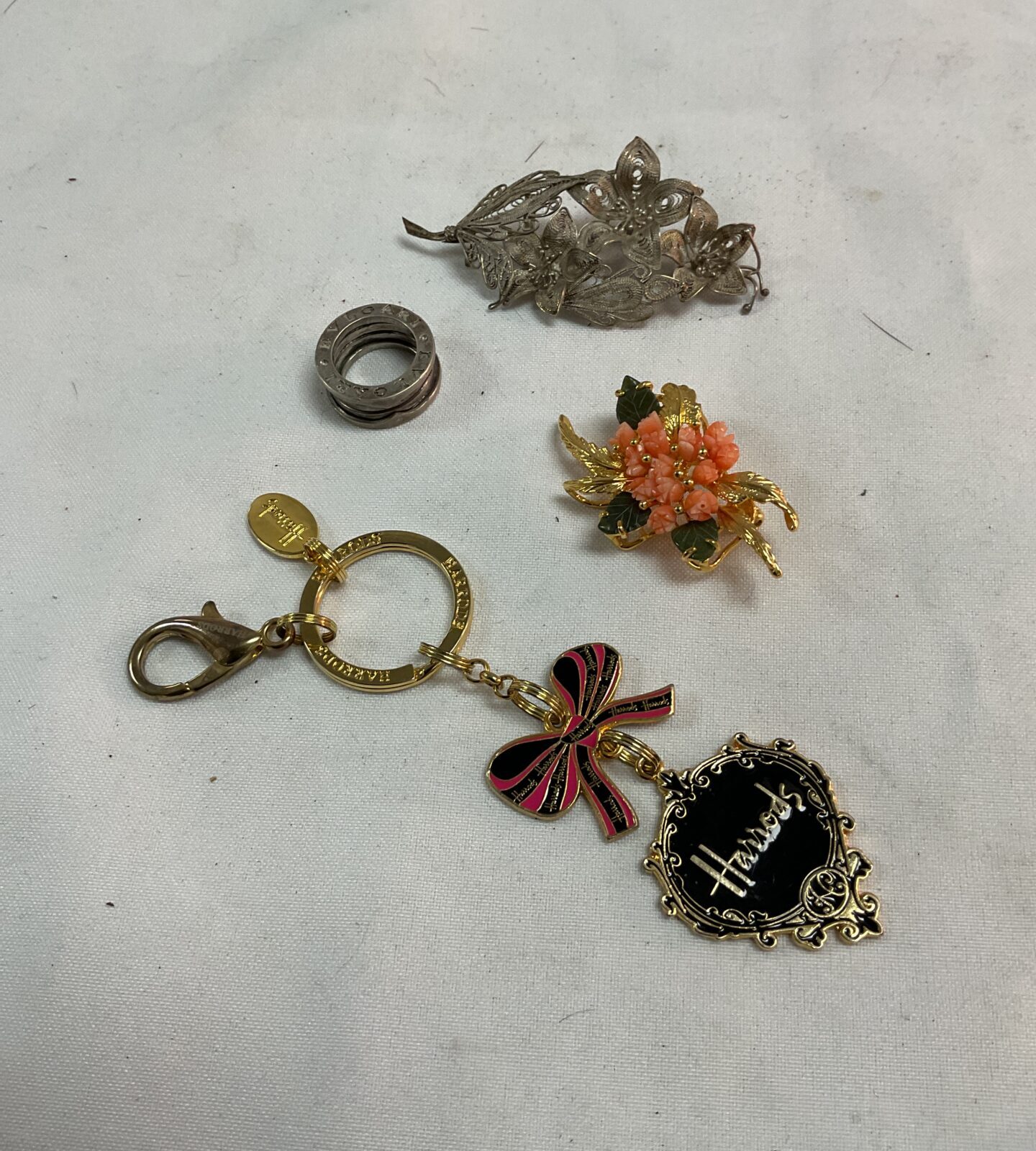 collection jewellery inc silver brooch , coral brooch and Harrods keyring