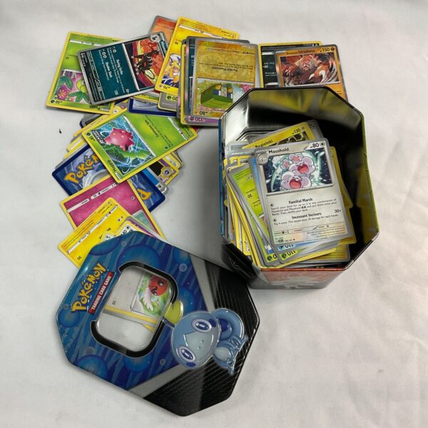 Tin of assorted Pokemon cards