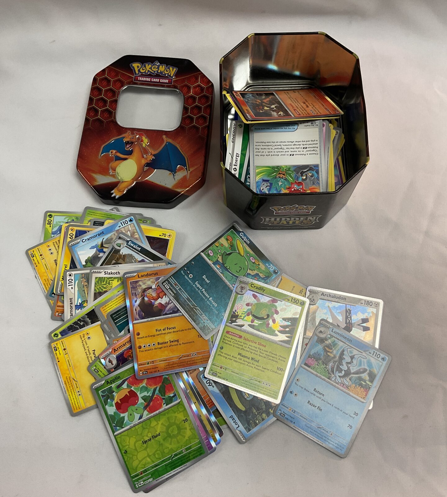 Tin of assorted Pokémon cards