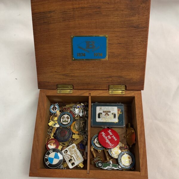 Assorted vintage enamel motoring pin badges in a collector's lot.