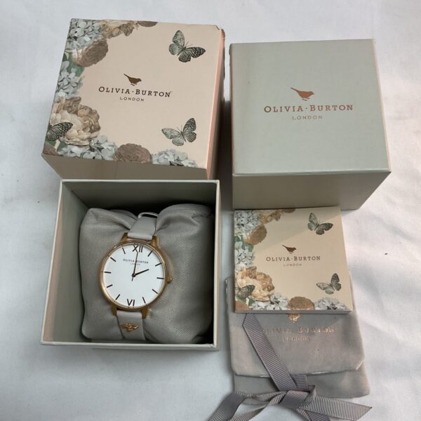 Gold Olivia Burton watch with delicate bracelet and original packaging.