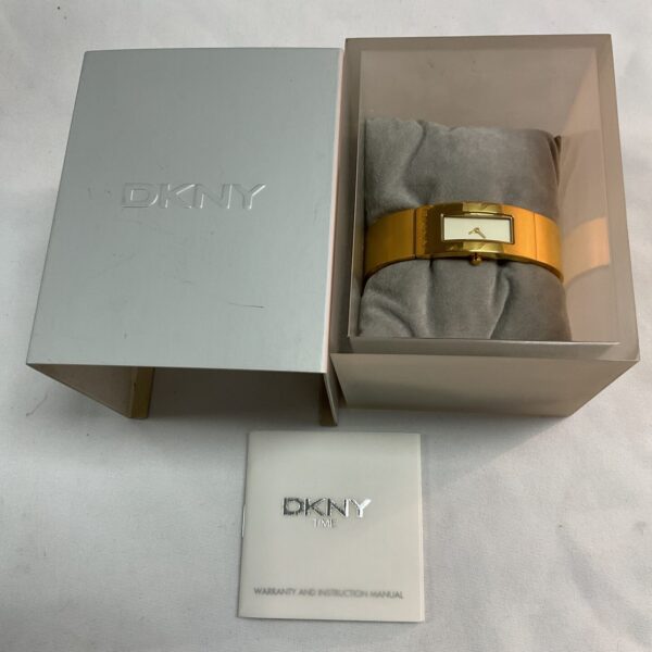 Vintage DKNY gold plated watch presented in its original box.