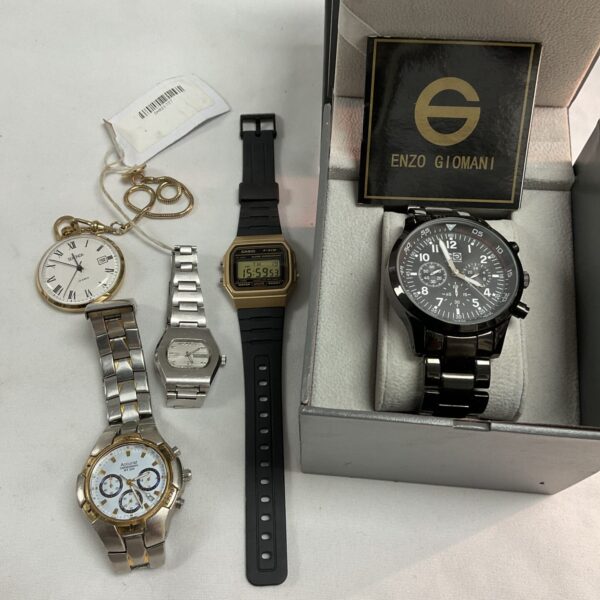 Vintage watch lot including Accurist, Casio, and Enzo Giomani timepieces.