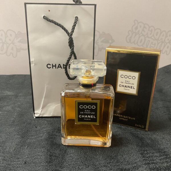 Vintage Coco Chanel perfume bottle, classic floral fragrance.