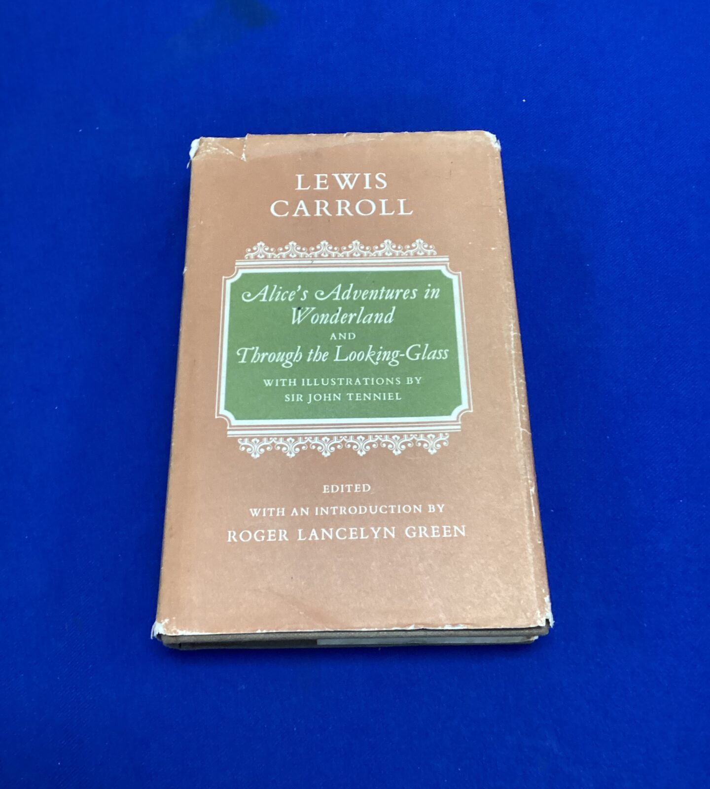 1976 copy of alice’s adventures in wonderland & through the looking glass