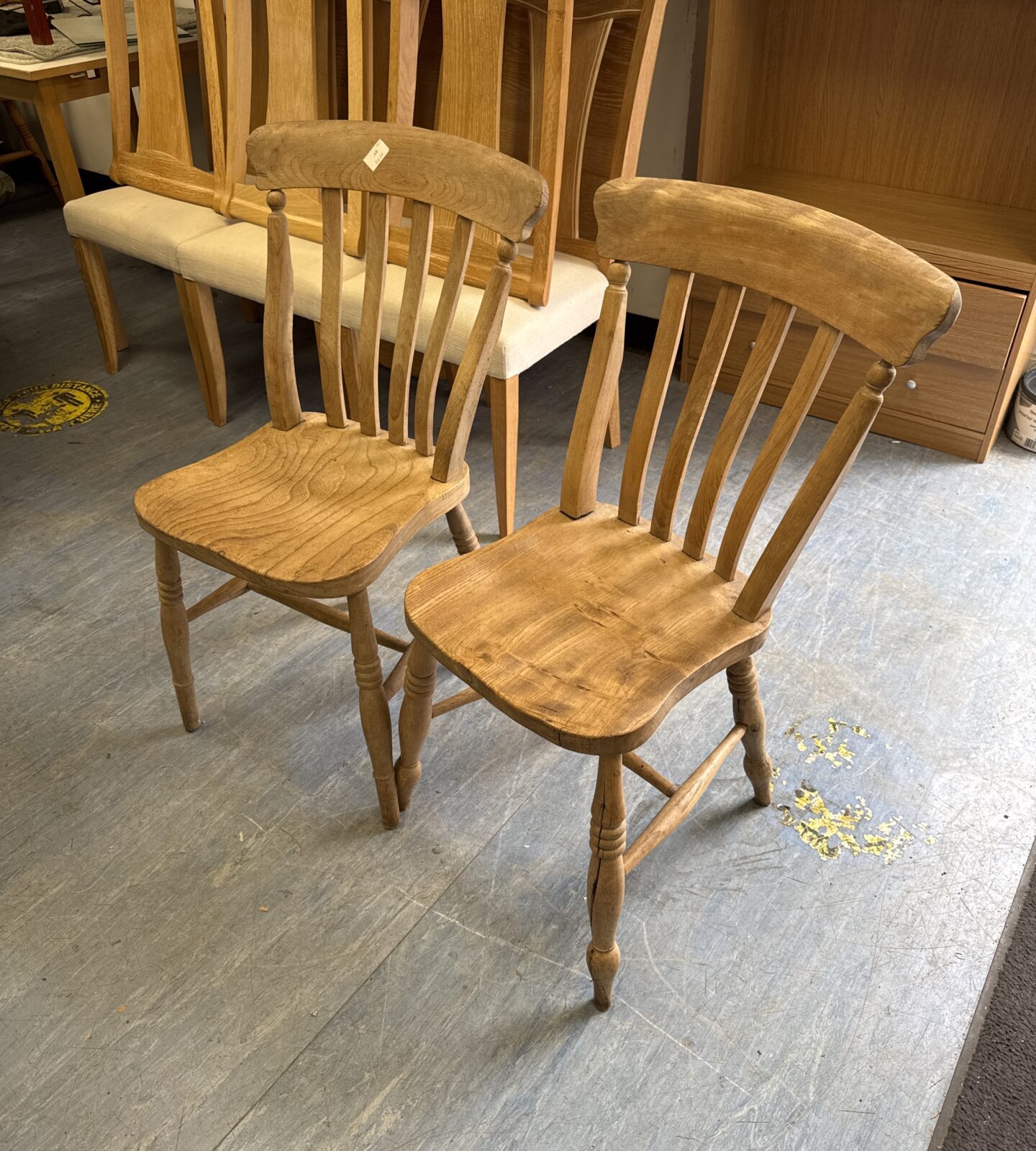 Two vintage rustic light oak chairs