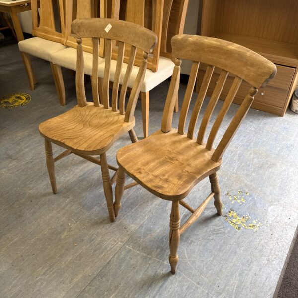 Two vintage rustic light oak chairs