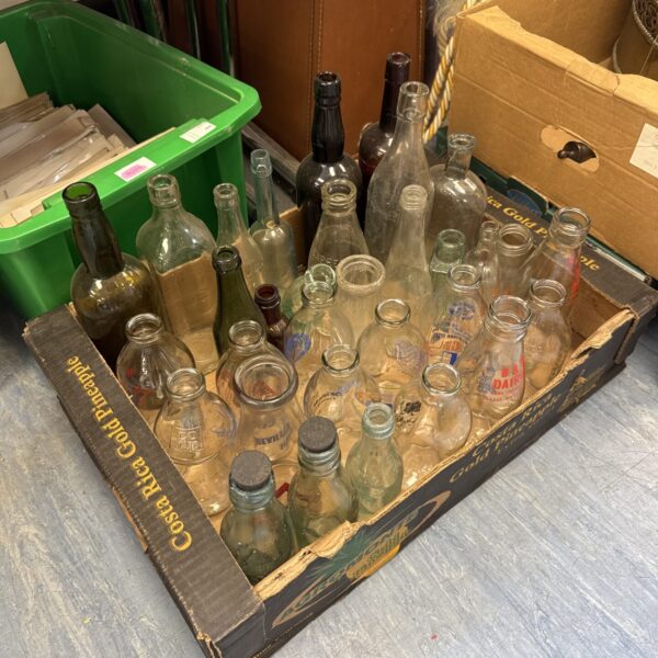 Box of assorted glass bottles inc vintage & milk advertisement