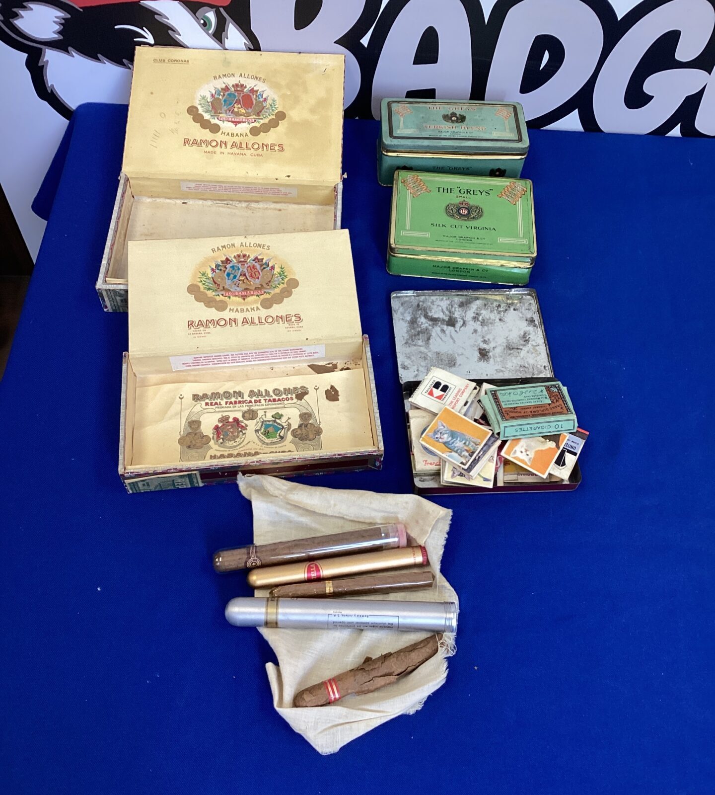 Vintage Cigar Boxes and Tins with vintage cigars and match books