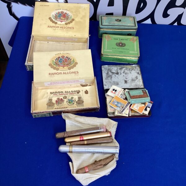 Vintage Cigar Boxes and Tins with vintage cigars and match books