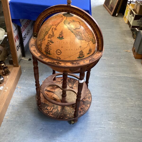 Vintage Zoffoli globe drinks cabinet in a room setting.