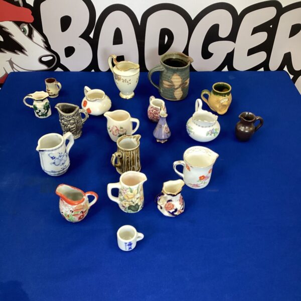 Collection of miniature porcelain and pottery jugs