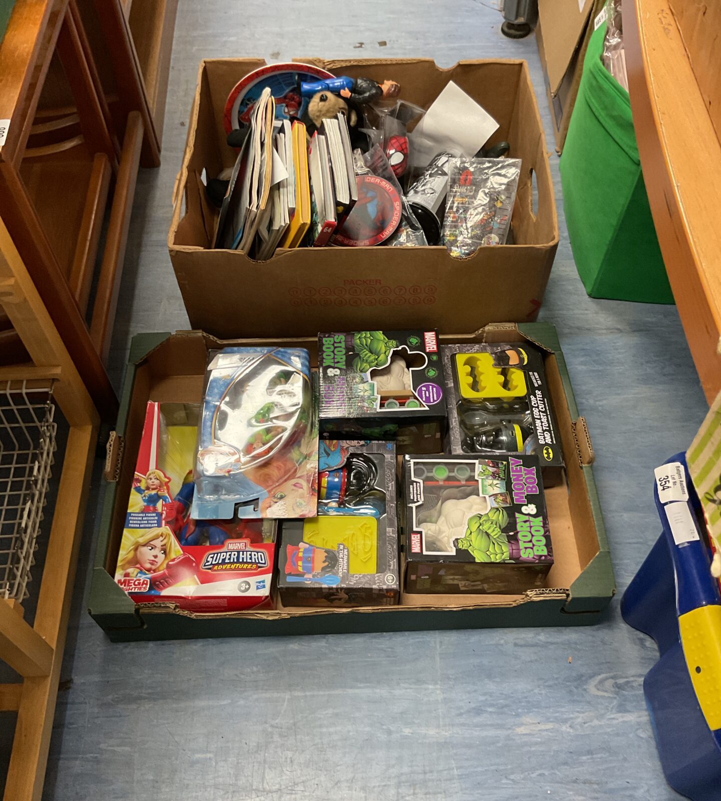 Two boxes of superhero related merchandise inc marvel and dc