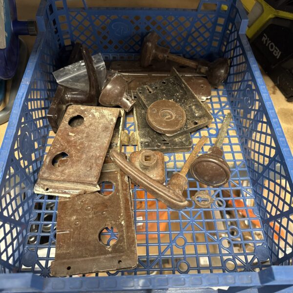 Basket of assorted vintage Bakelite door furniture