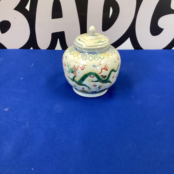 Antique Chinese ginger jar with vibrant dragon and floral design.