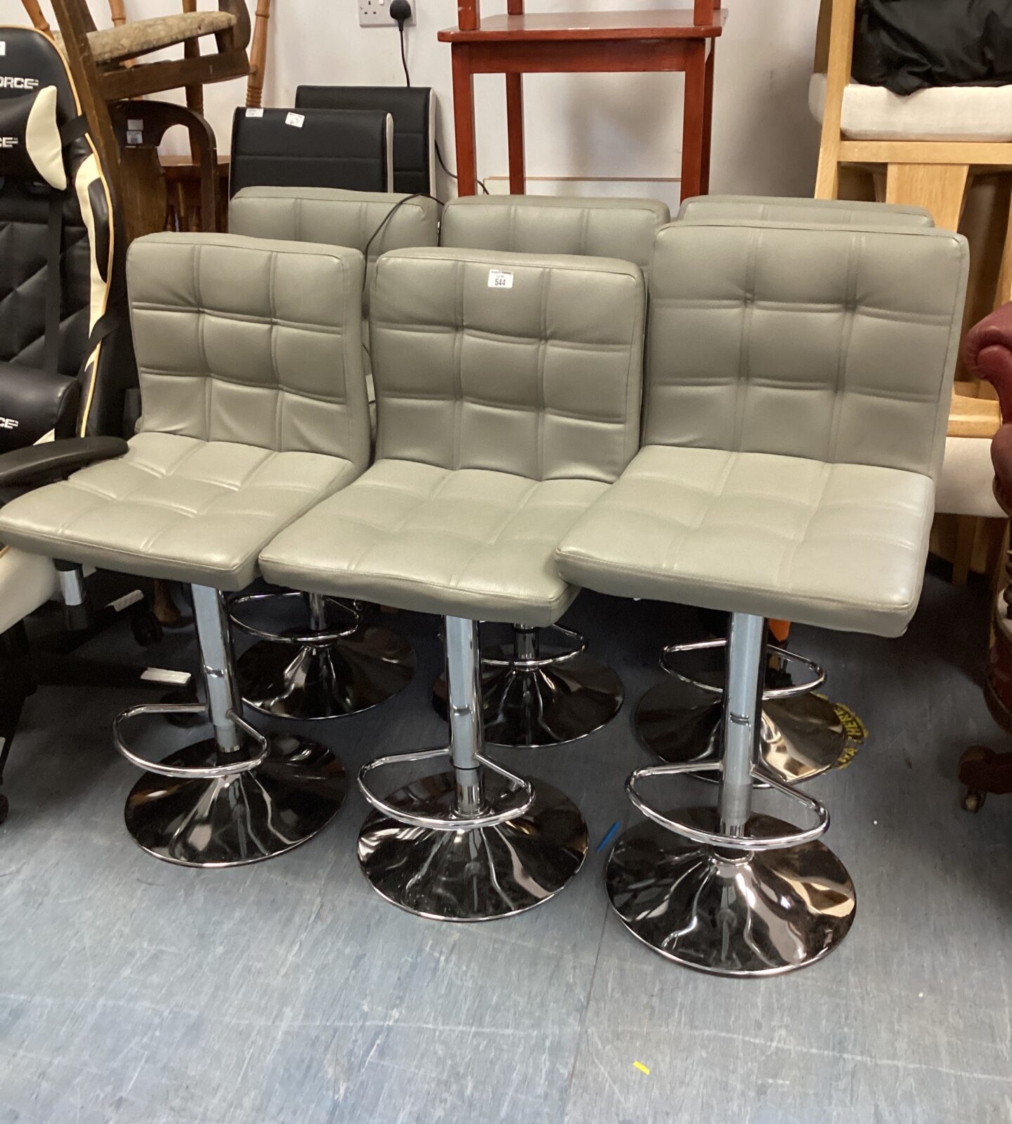 Six grey leather bar stools