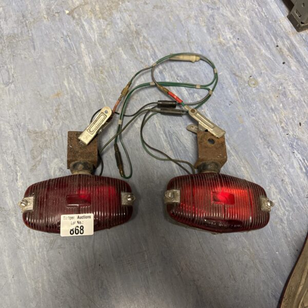 Two vintage vehicle rear lights