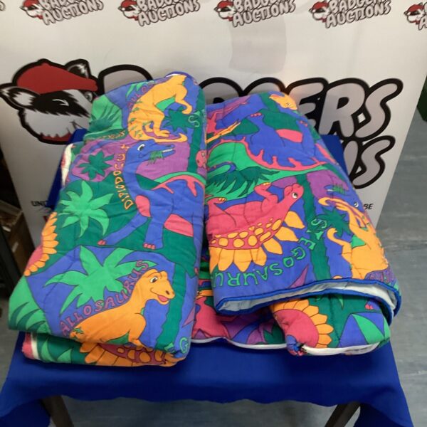 Two dinosaur sleeping bags