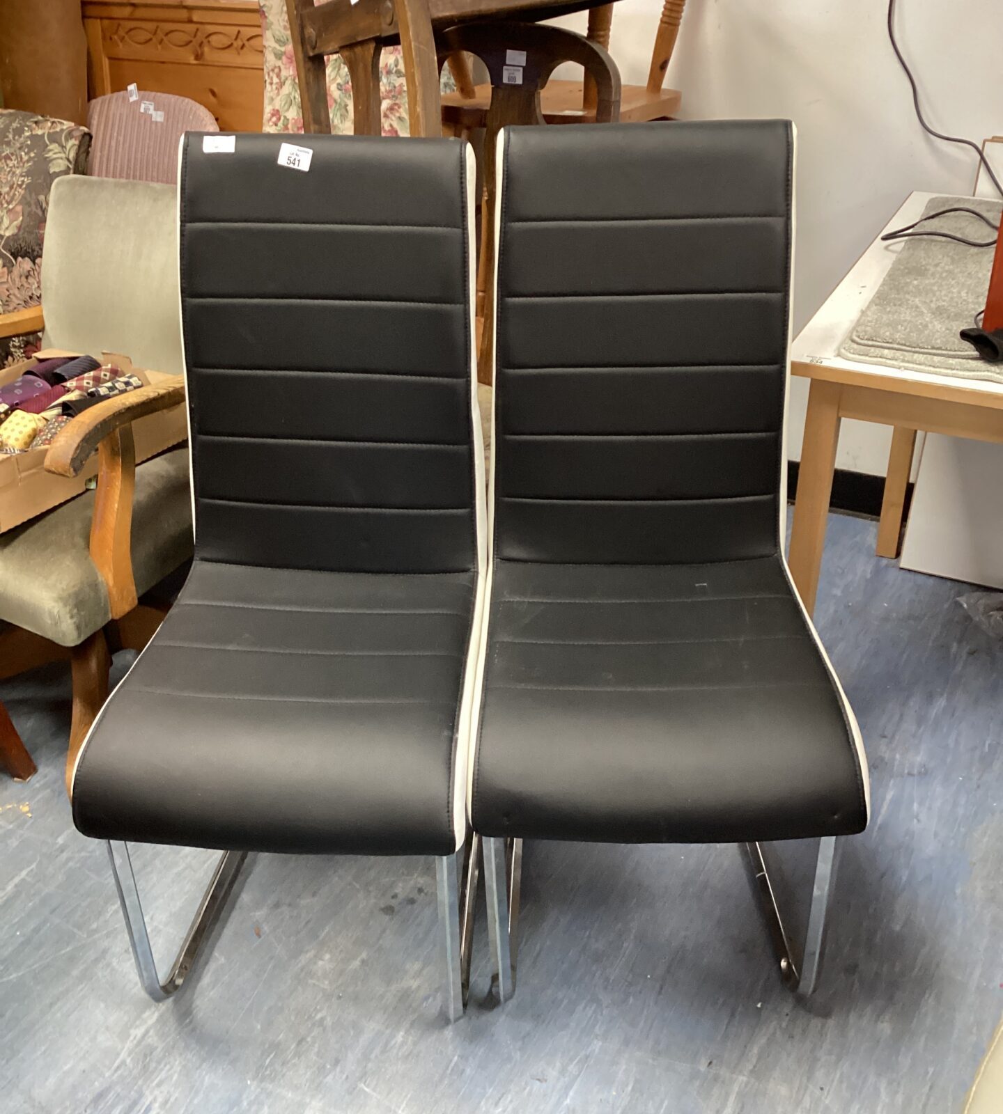 Two black & white leather dining chairs