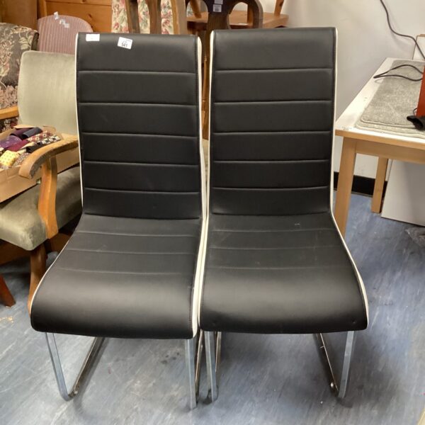 Two black & white leather dining chairs
