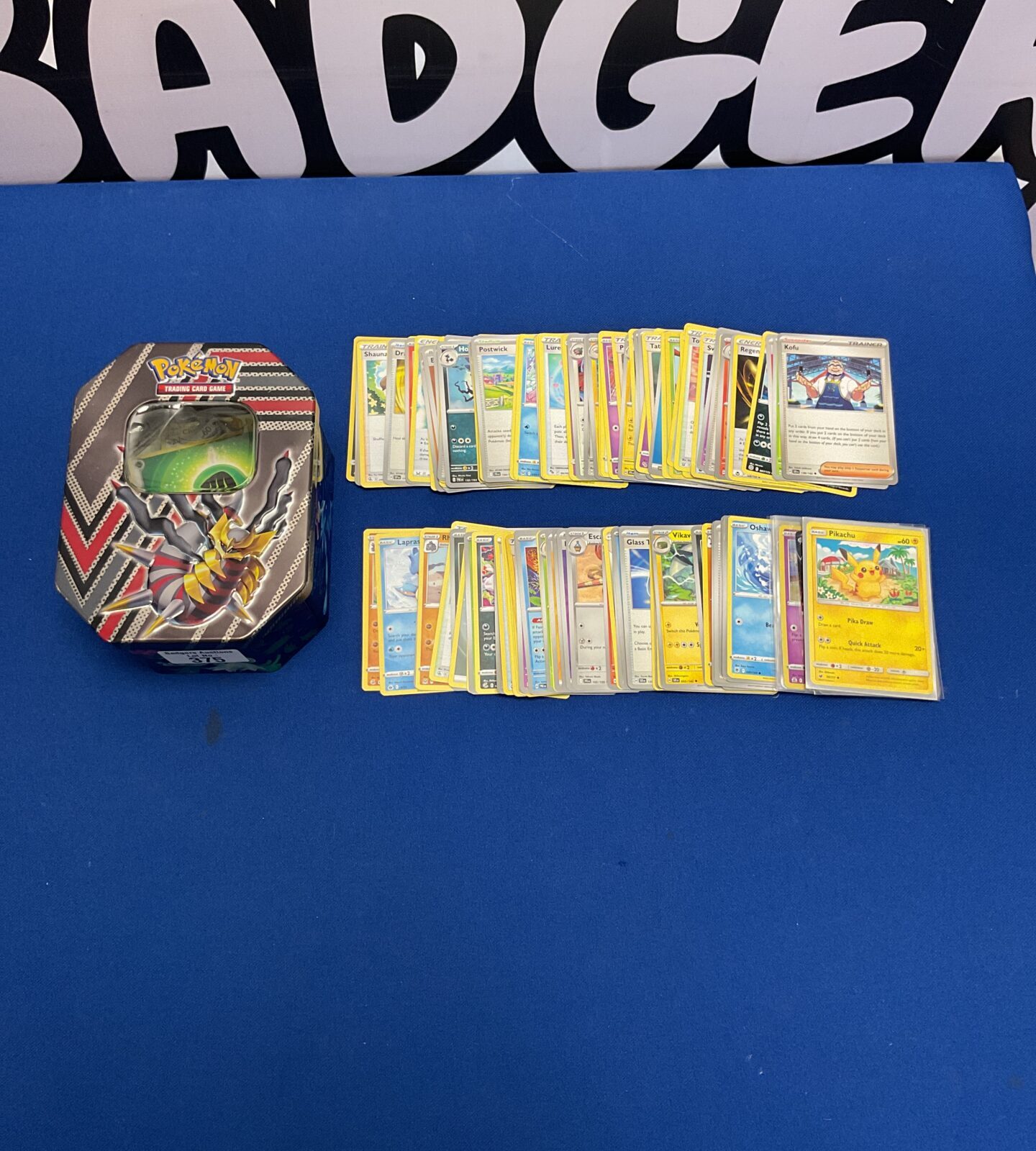 Selection pf pokemon cards in tin inc pikachu