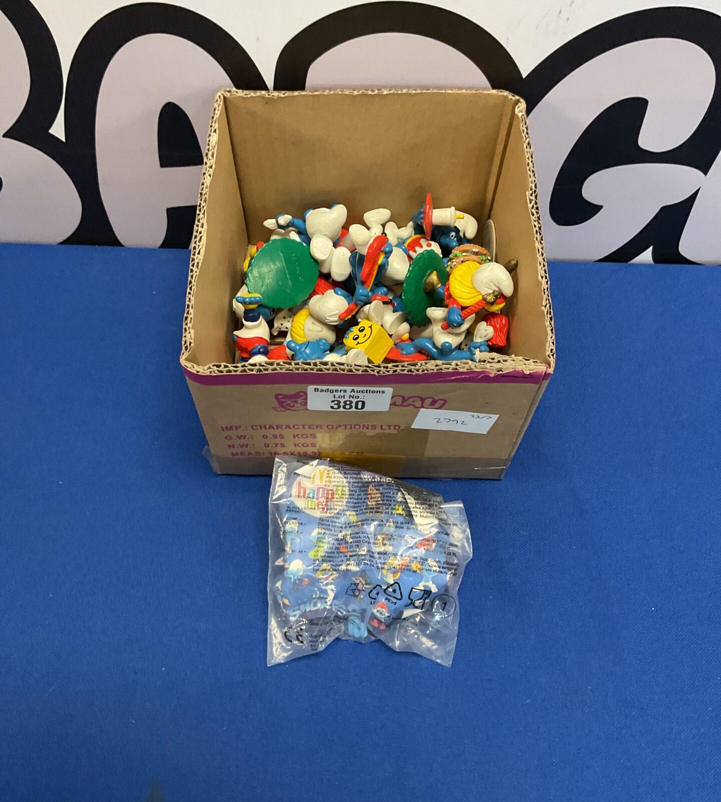 Box of retro mcdonalds and payo smurf figures