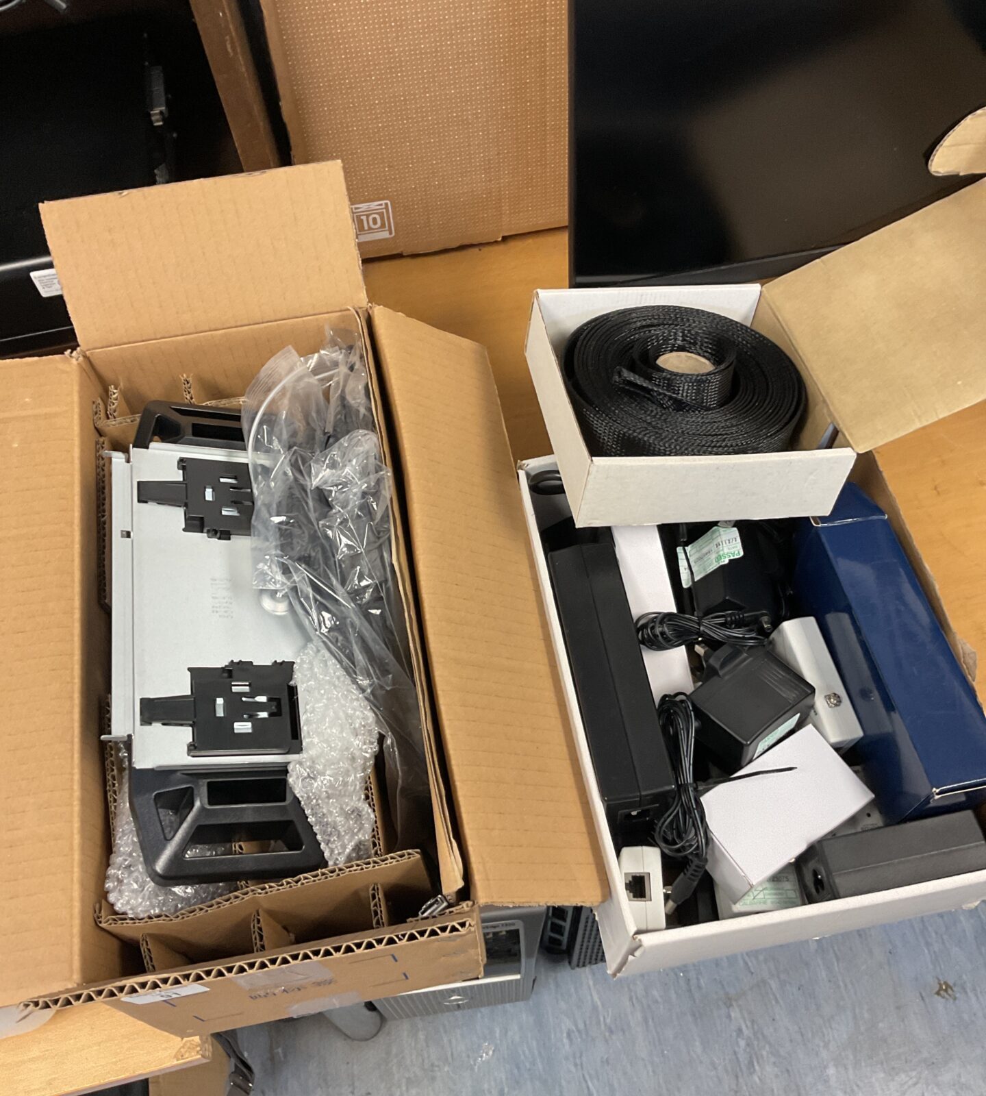 Two boxes of various power supplies