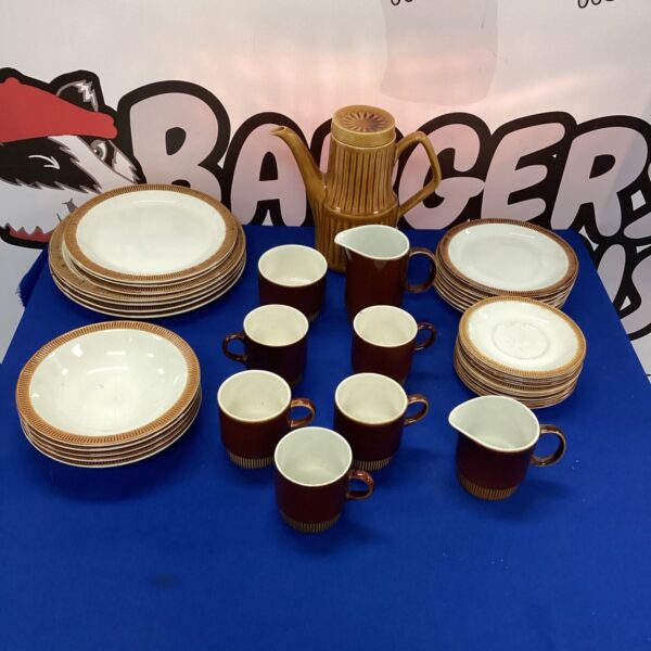 Vintage Poole Pottery dinner service set on display.