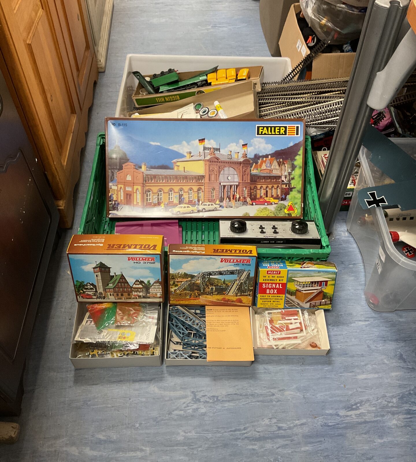 Two boxes of mixed vintage model train items inc boxed model kits, tracks, carriages and twin power supply unit