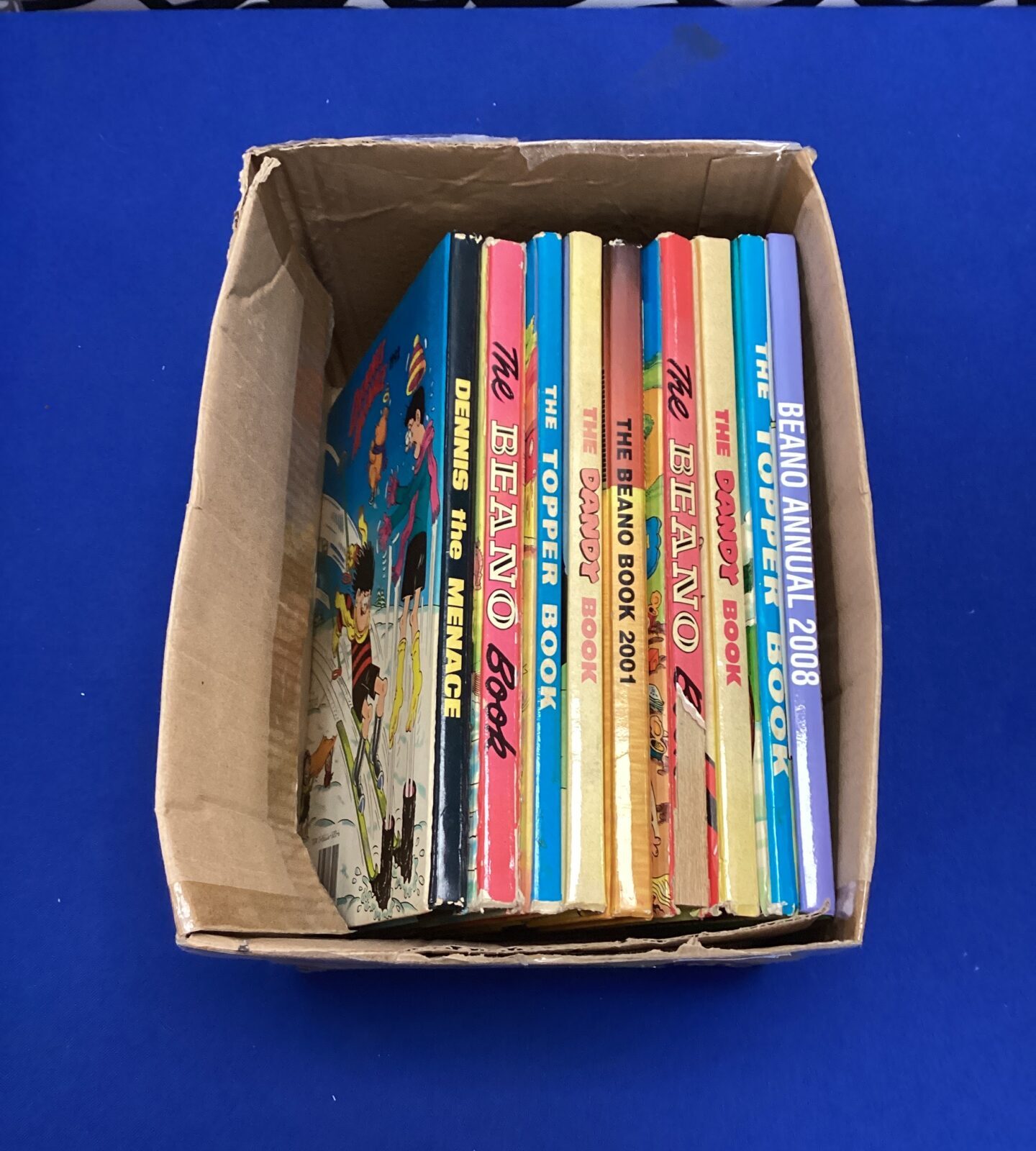 Box of beano, dandy & dennis the menace annuals