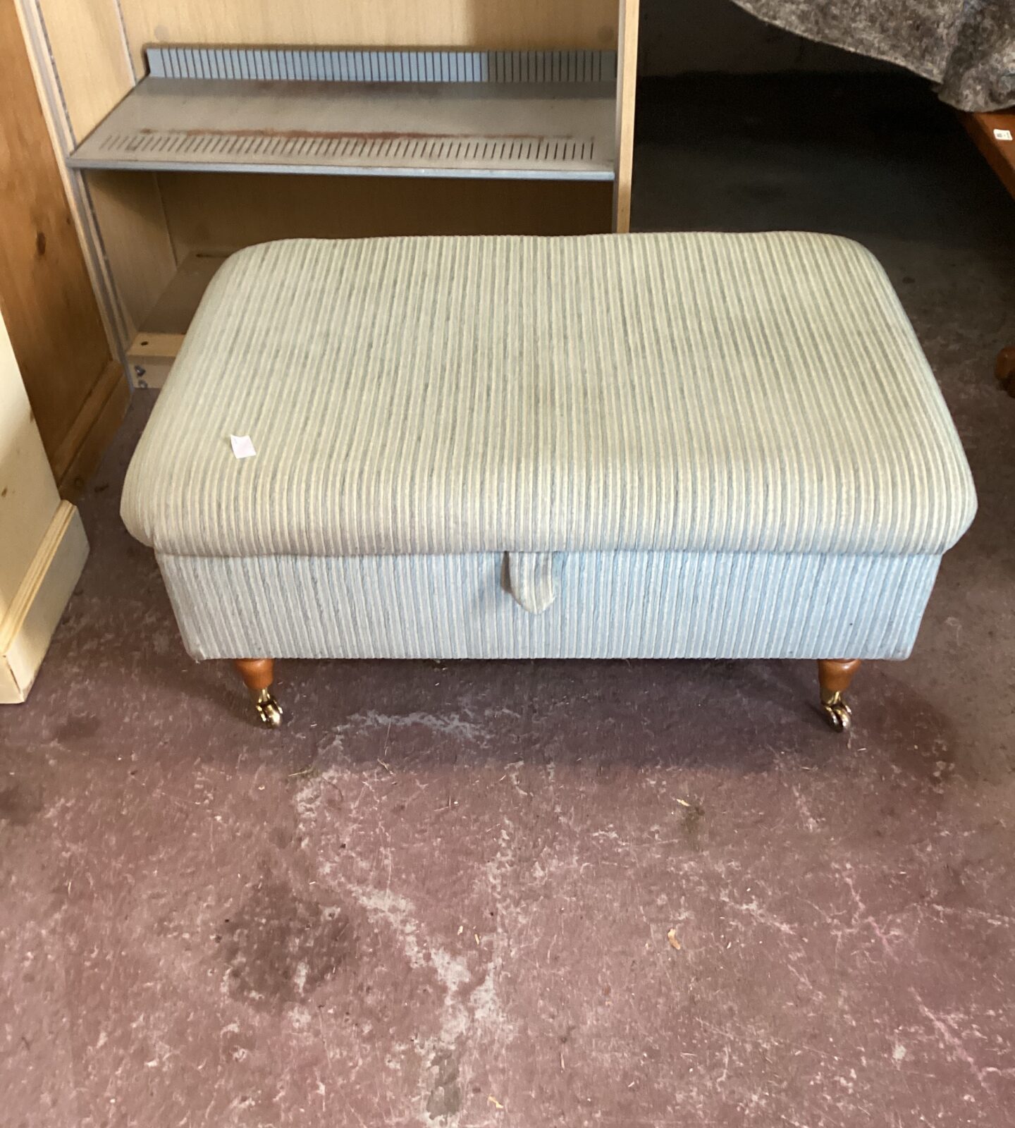 Castor legged footstool/Ottoman