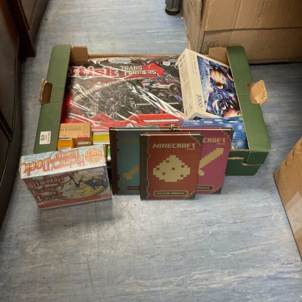Box of mixed games and collectables inc mincraft handbooks, board games and puzzle