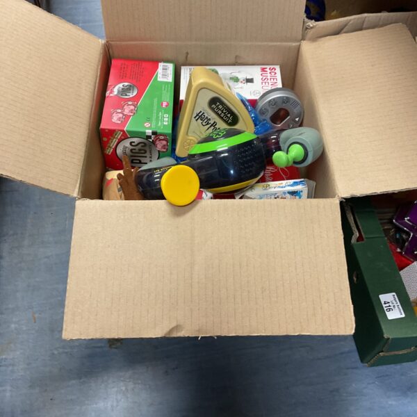 Box full of mixed games and toys