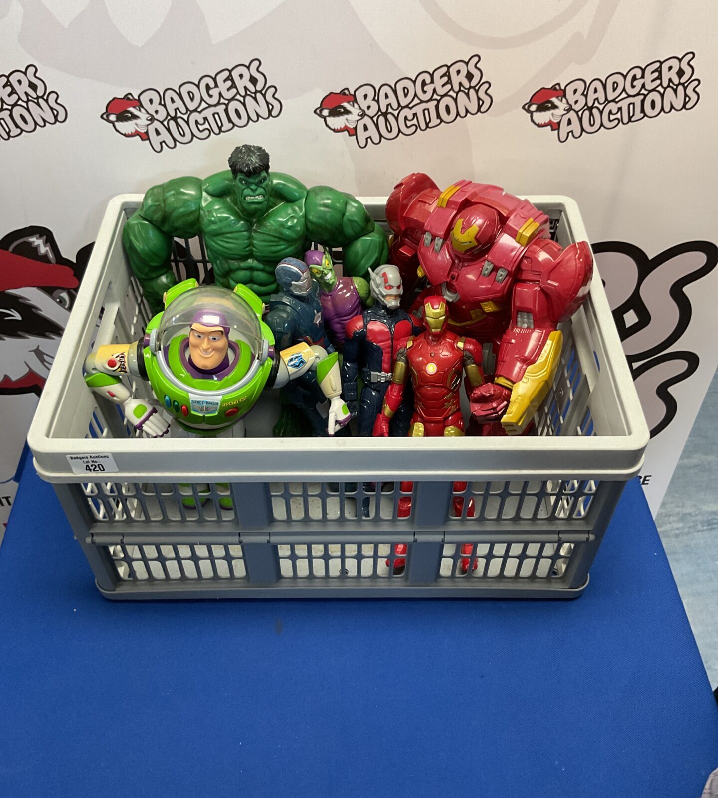 Crate of marvel and disney pixar action figures inc