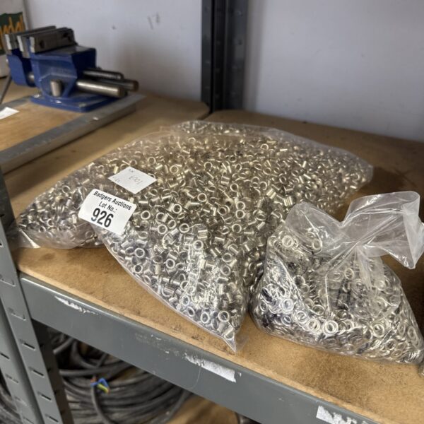Two sealed bags of small fabric eyelets