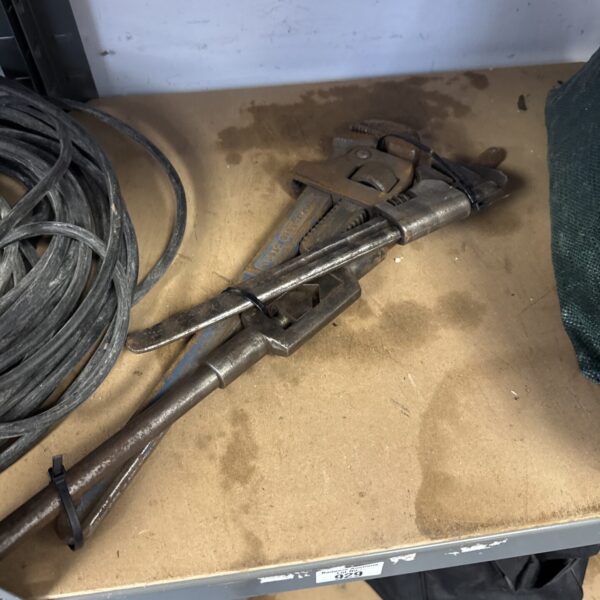 Two pairs of stilson grips & a thread tapping spanner