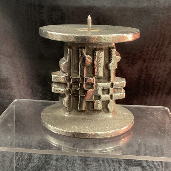 Front view of Olaf Joff Spode stainless steel candle holder.