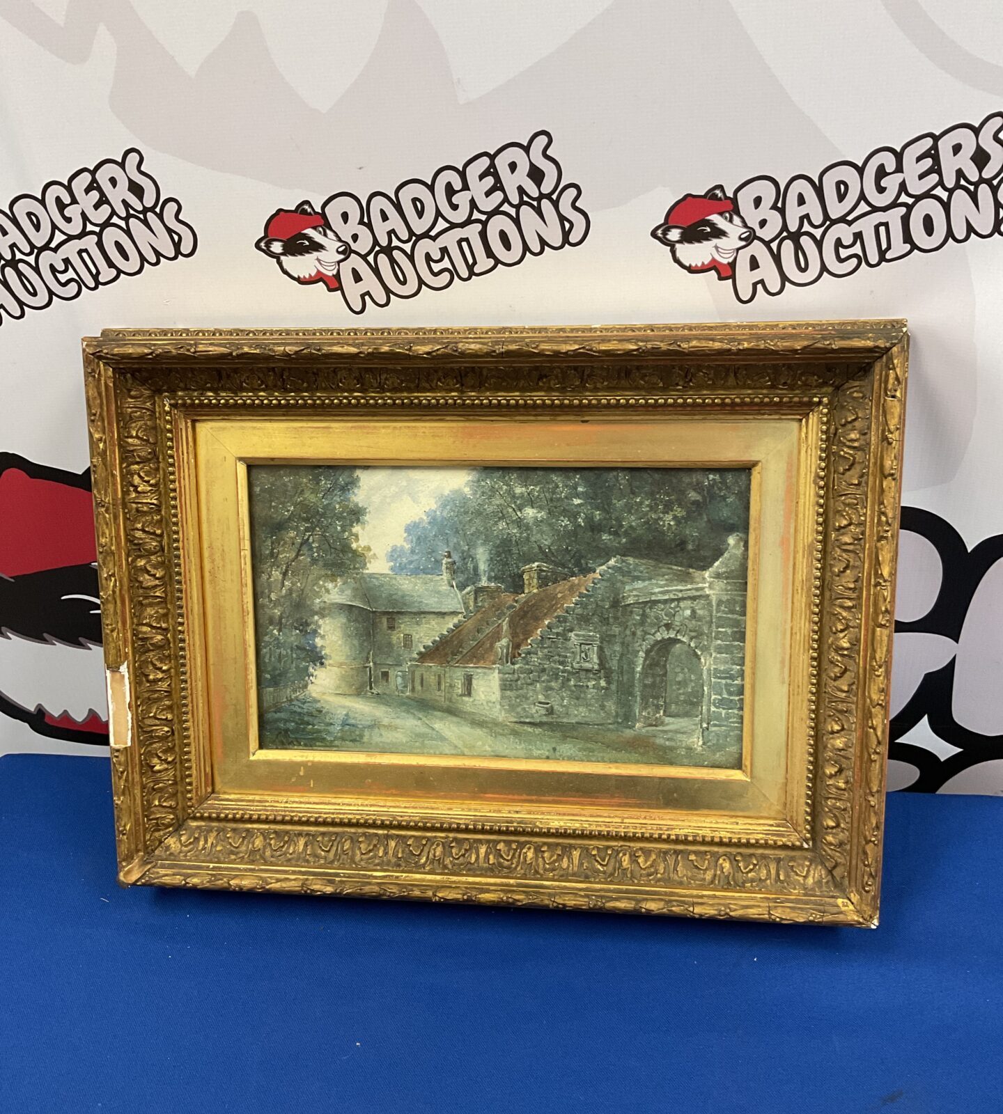 Signed 19th century gilt framed watercolour of a castle gate house