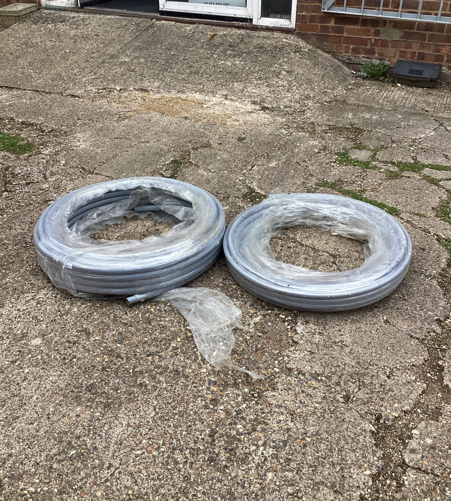 Two rolls of plastic 22mm pipe