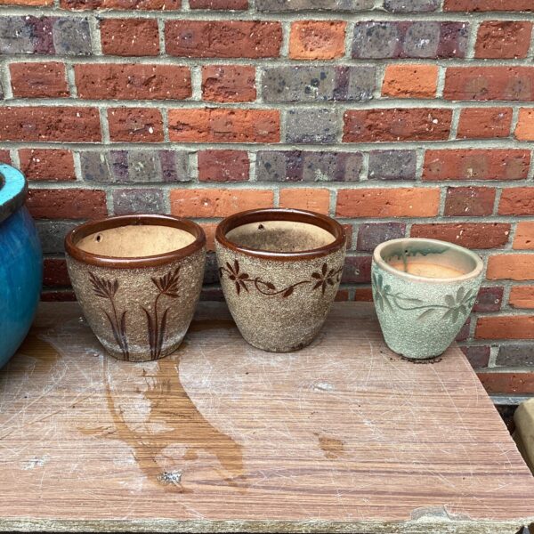 Three decorative garden pots