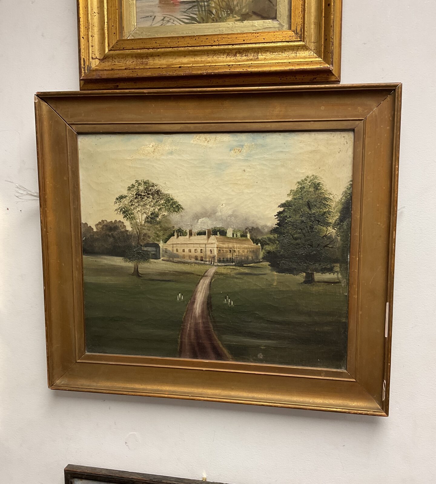 Antique gilt framed oil painting of a Manor House